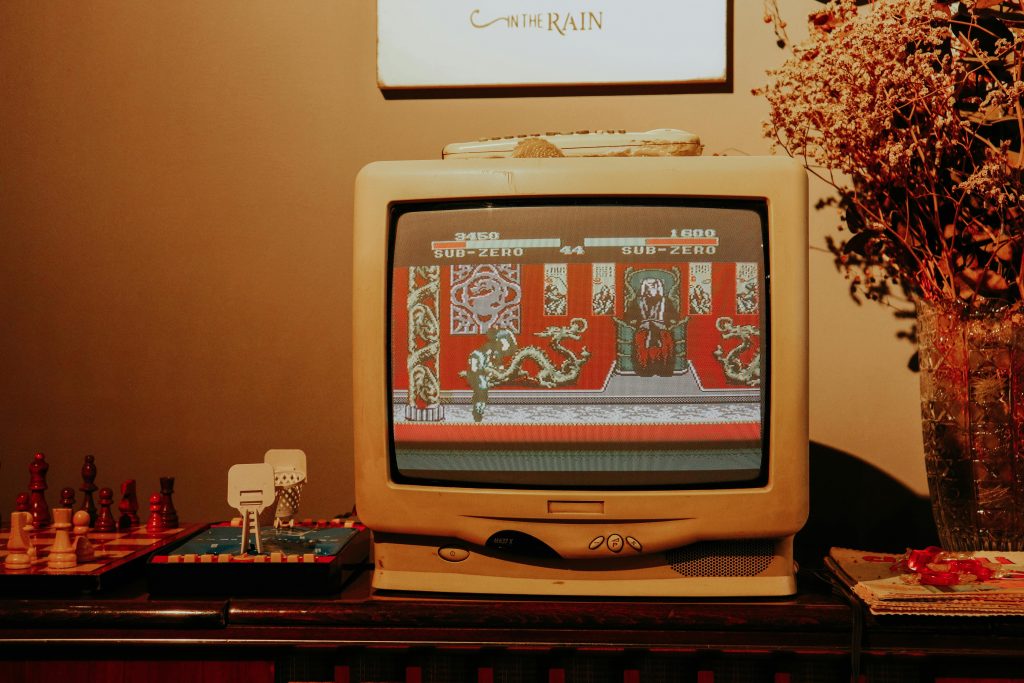 Retro living room scene featuring vintage TV playing classic video game.